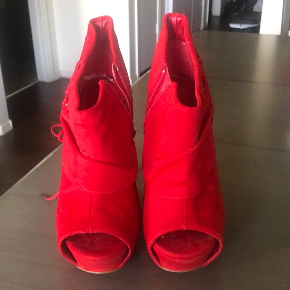 A pair of red faux suede heels